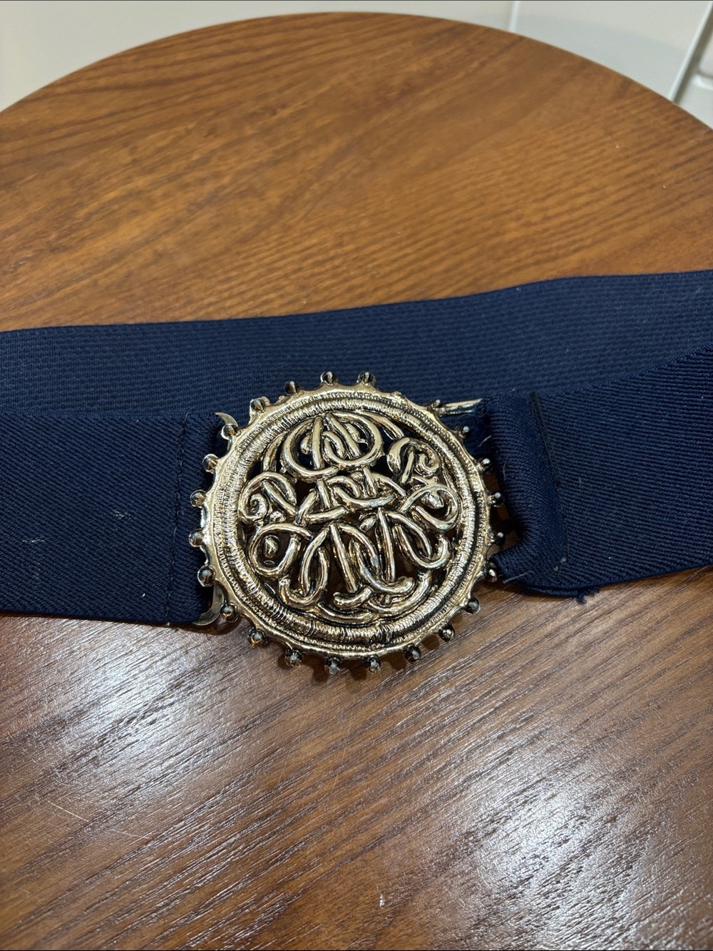 Elastic Navy Belt with Decorative Gold Medallion